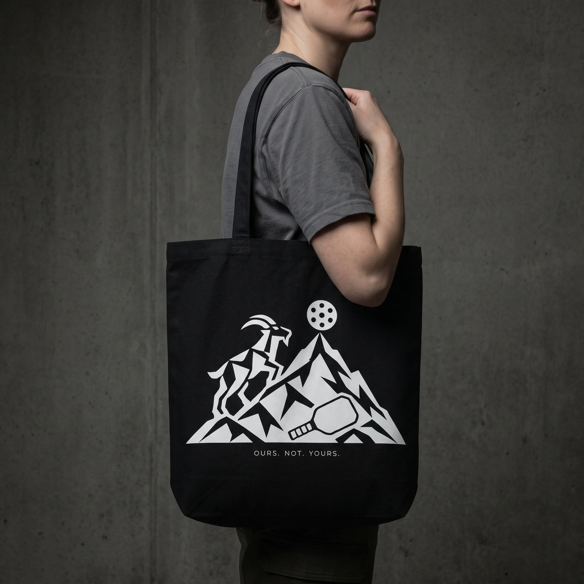 Capricorn — The Top Is Taken tote bag — close-up of the black pickleball tote bag on the shoulder