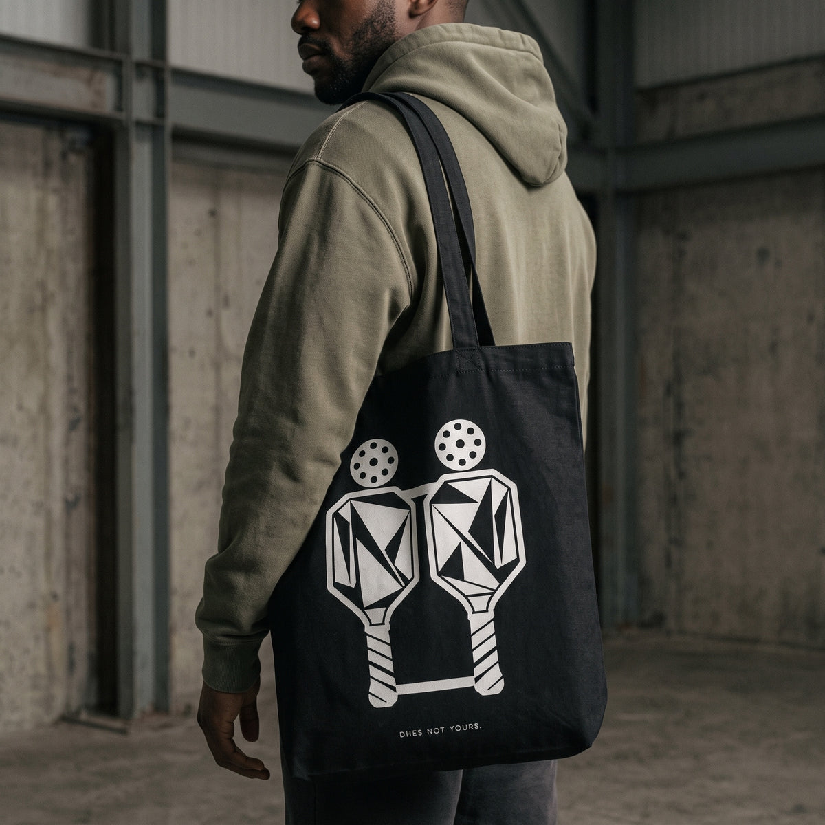 Gemini — Split Form tote bag — close-up of the black pickleball tote bag on the shoulder