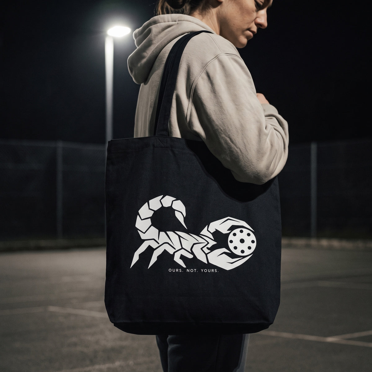 Scorpio — Soft Shot tote bag — close-up of the black pickleball tote bag on the shoulder