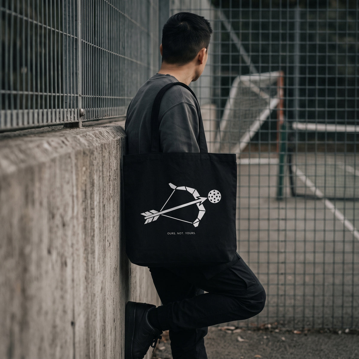 Sagittarius — Target Locked tote bag — model carrying the black organic cotton pickleball tote bag