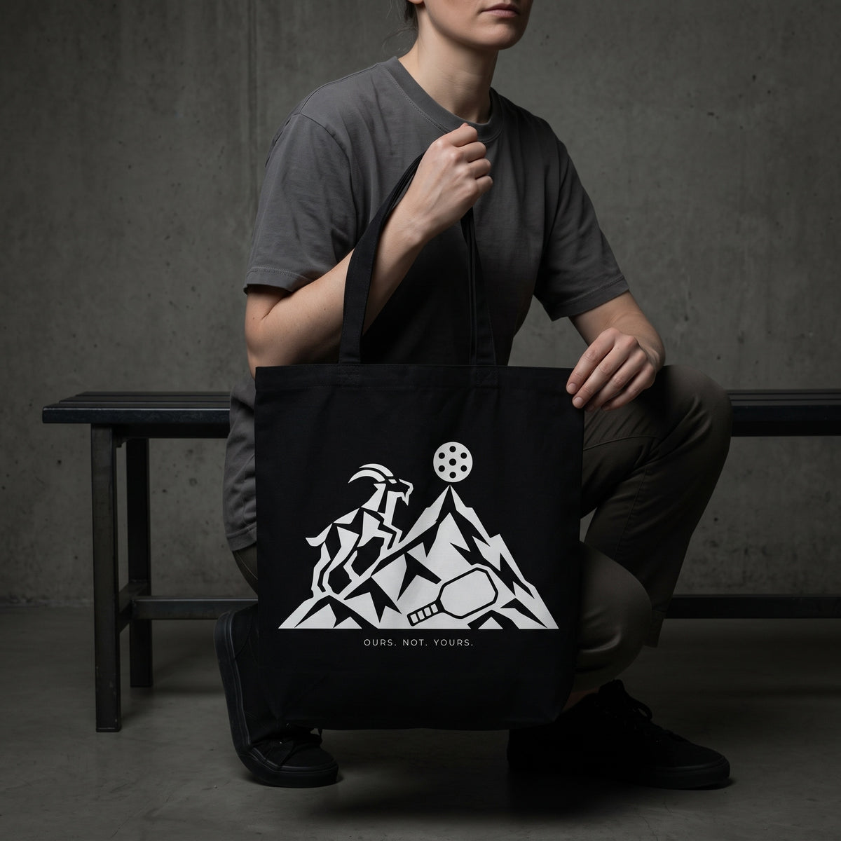 Capricorn — The Top Is Taken tote bag — model carrying the black organic cotton pickleball tote bag