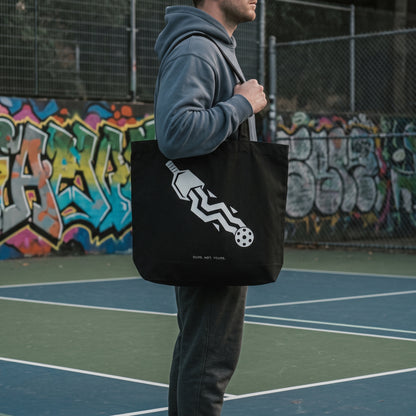 Aquarius — Disrupt The Flow tote bag — close-up of the black pickleball tote bag on the shoulder